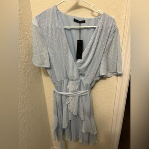 Never worn, tags still on. Light blue with some sparkles , ruffled